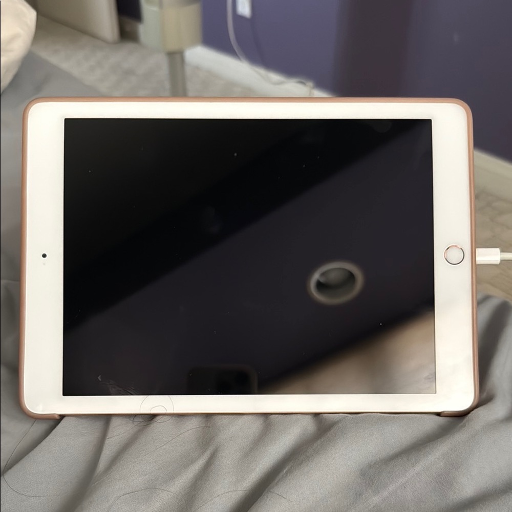 Gold and White Tablet with Sleek Design - 4th generation